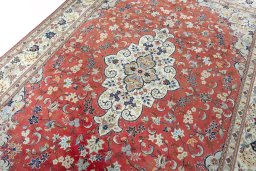 Backside of handmade New Kashan rug showing knot structure and weave density