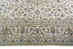 Corner detail of 2000s Kashan rug showing border pattern and Wool pile