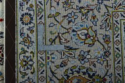 Backside of handmade 2000s Kashan rug showing knot structure and weave density