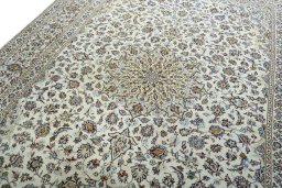 Backside of handmade 2000s Kashan rug showing knot structure and weave density