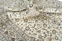 Surface texture of 2000s Kashan rug with natural Wool and intricate pattern