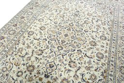 Backside of handmade 2000s Kashan rug showing knot structure and weave density