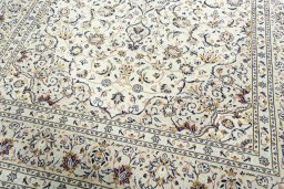 Close-up detail of 2000s Kashan rug from Iran / Persia showing Wool weave