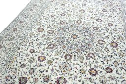 Backside of handmade 2000s Kashan rug showing knot structure and weave density