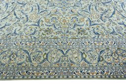 Corner detail of 2000s Kashan rug showing border pattern and Wool pile