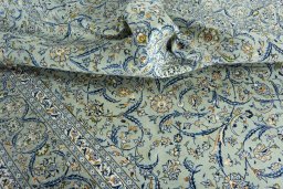 Surface texture of 2000s Kashan rug with natural Wool and intricate pattern