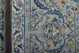 Backside of handmade 2000s Kashan rug showing knot structure and weave density