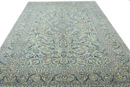 Surface texture of 2000s Kashan rug with natural Wool and intricate pattern
