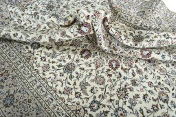Surface texture of 2000s Kashan rug with natural Wool and intricate pattern