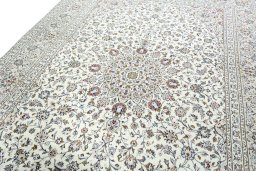 Backside of handmade 2000s Kashan rug showing knot structure and weave density