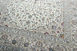 Close-up detail of 2000s Kashan rug from Iran / Persia showing Wool weave