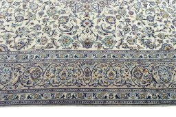 Corner detail of 2000s Kashan rug showing border pattern and Wool pile