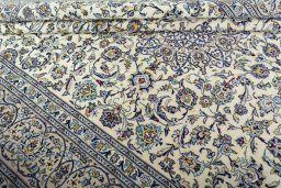 Close-up detail of 2000s Kashan rug from Iran / Persia showing Wool weave