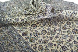Surface texture of 2000s Kashan rug with natural Wool and intricate pattern