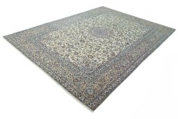 Corner detail of 2000s Kashan rug showing border pattern and Wool pile
