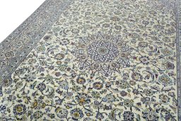 Backside of handmade 2000s Kashan rug showing knot structure and weave density