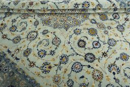 Close-up detail of 2000s Kashan rug from Iran / Persia showing Wool weave