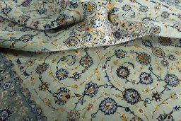 Surface texture of 2000s Kashan rug with natural Wool and intricate pattern