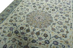 Backside of handmade 2000s Kashan rug showing knot structure and weave density