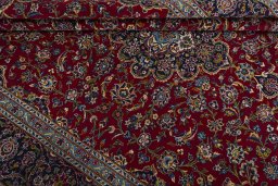 Close-up detail of 2000s Kashan rug from Iran / Persia showing Wool weave
