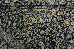 Close-up detail of 2000s Kashan rug from Iran / Persia showing Wool weave