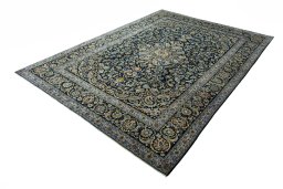 Corner detail of 2000s Kashan rug showing border pattern and Wool pile