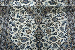 Close-up detail of 2000s Kashan rug from Iran / Persia showing Wool weave