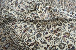 Surface texture of 2000s Kashan rug with natural Wool and intricate pattern