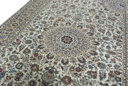 Backside of handmade 2000s Kashan rug showing knot structure and weave density