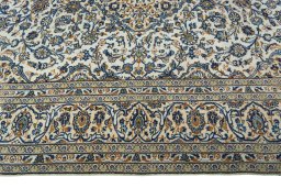 Corner detail of 2000s Kashan rug showing border pattern and Wool pile