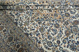 Close-up detail of 2000s Kashan rug from Iran / Persia showing Wool weave