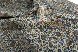 Surface texture of 2000s Kashan rug with natural Wool and intricate pattern
