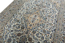 Backside of handmade 2000s Kashan rug showing knot structure and weave density