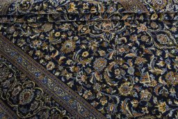 Close-up detail of 2000s Kashan rug from Iran / Persia showing Wool weave