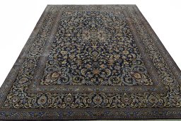 Surface texture of 2000s Kashan rug with natural Wool and intricate pattern