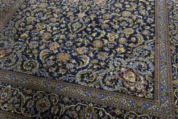 Close-up detail of 2000s Kashan rug from Iran / Persia showing Wool weave