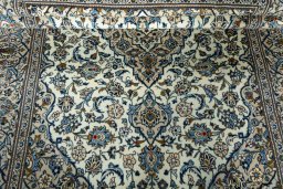 Close-up detail of 2000s Kashan rug from Iran / Persia showing Wool weave