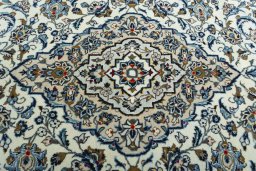 Central medallion detail of 2000s Kashan rug from Iran / Persia