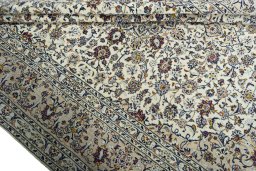 Close-up detail of 2000s Kashan rug from Iran / Persia showing Wool weave