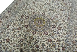 Backside of handmade 2000s Kashan rug showing knot structure and weave density