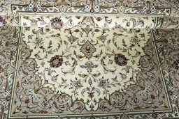 Close-up detail of 2000s Kashan rug from Iran / Persia showing Wool weave