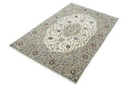 Corner detail of 2000s Kashan rug showing border pattern and Wool pile