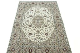 Surface texture of 2000s Kashan rug with natural Wool and intricate pattern