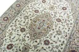 Backside of handmade 2000s Kashan rug showing knot structure and weave density