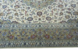 Corner detail of New Kashan rug showing border pattern and Cork pile