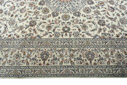 Corner detail of 2000s Kashan rug showing border pattern and Wool pile