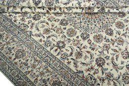 Close-up detail of 2000s Kashan rug from Iran / Persia showing Wool weave