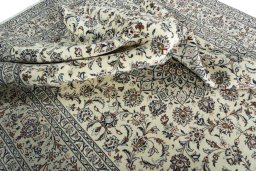 Surface texture of 2000s Kashan rug with natural Wool and intricate pattern