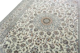Backside of handmade 2000s Kashan rug showing knot structure and weave density