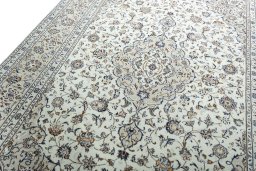 Surface texture of 2000s Kashan rug with natural Wool and intricate pattern